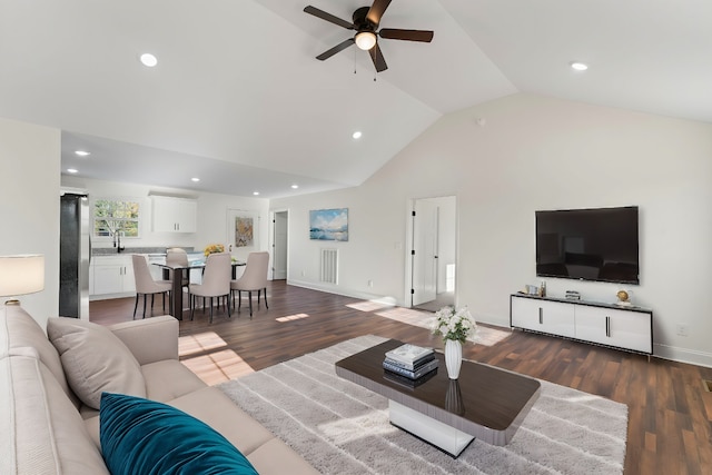 living room featuring lofted ceiling, ceiling fan, and dark hardwood / wood-style flooring