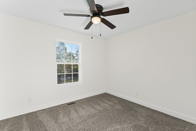 spare room with ceiling fan and carpet floors