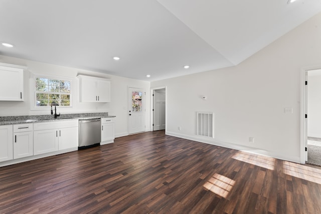 kitchen with sink, stainless steel dishwasher, dark hardwood / wood-style floors, and white cabinets