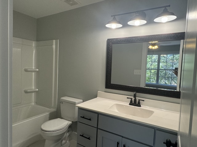 full bathroom featuring vanity, toilet, washtub / shower combination, and ceiling fan