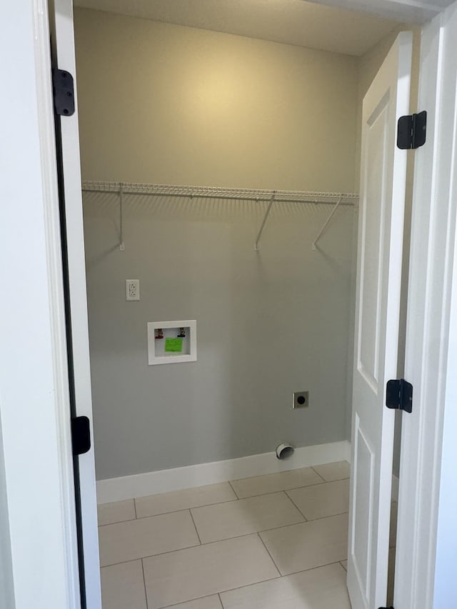 954 Greenwood Ave, Clarksville, TN 37040 - washroom with washer hookup, hookup for an electric dryer, laundry area, light tile patterned floors, and baseboards