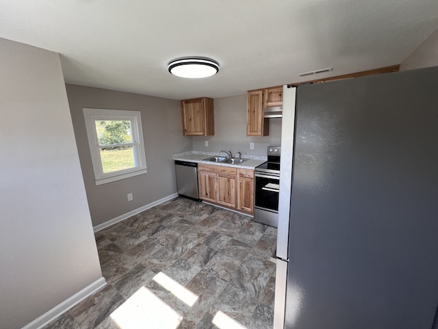 kitchen with appliances with stainless steel finishes and sink