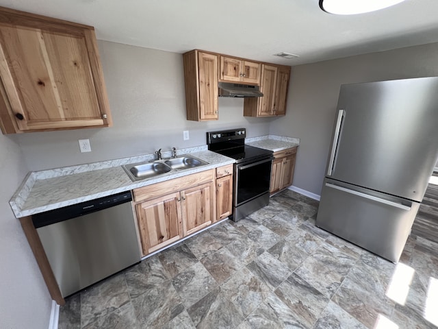 kitchen with sink and appliances with stainless steel finishes