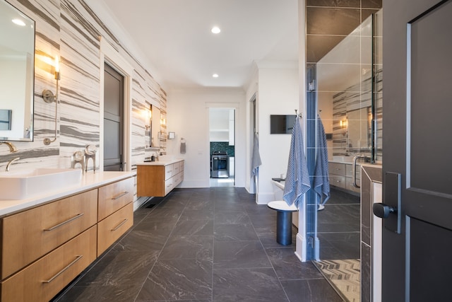 bathroom with vanity, tasteful backsplash, ornamental molding, and walk in shower