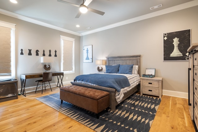 bedroom with ornamental molding, light hardwood / wood-style flooring, and ceiling fan