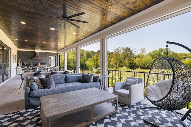 view of patio / terrace with an outdoor living space, area for grilling, and ceiling fan