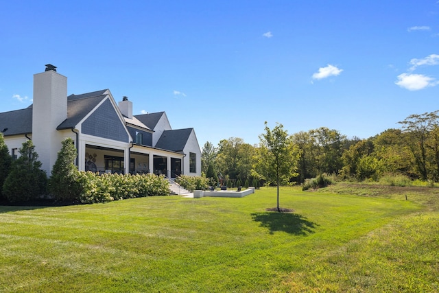 view of home's exterior featuring a lawn