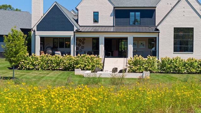 view of front of property with a front lawn and a porch