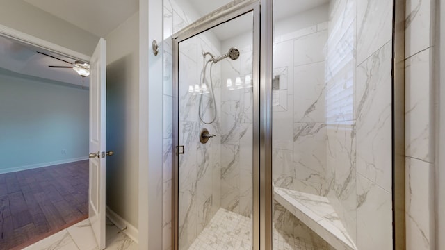 bathroom featuring an enclosed shower, hardwood / wood-style flooring, and ceiling fan