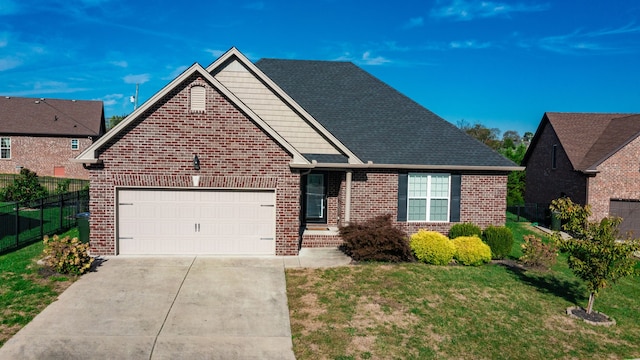 view of front of property with a front yard and a garage