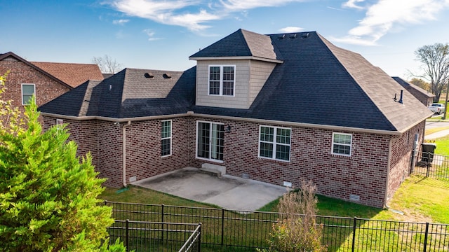 back of property featuring a patio area and a yard