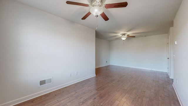 unfurnished room with light wood-type flooring and ceiling fan