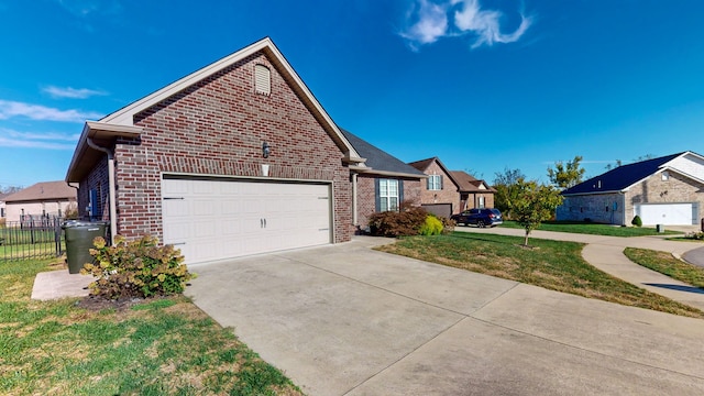 view of property exterior featuring a garage and a lawn