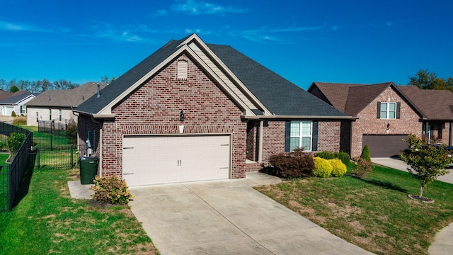 view of front facade featuring a front lawn and a garage