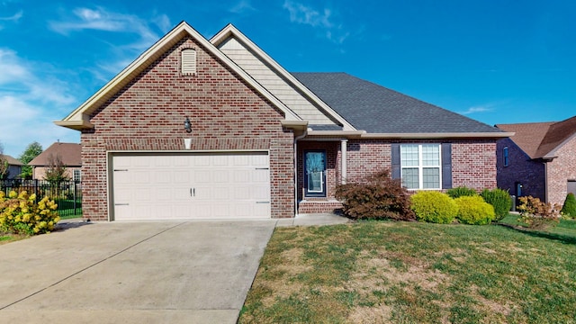 front of property featuring a front yard and a garage