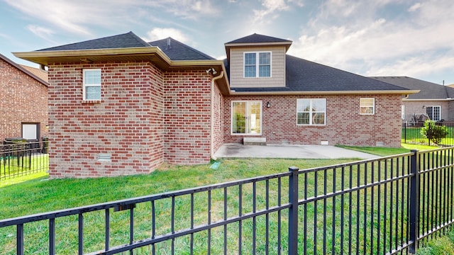 back of house featuring a yard and a patio