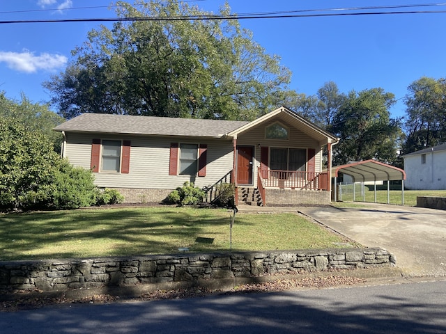 view of front of house with covered porch, a carport, and a front yard