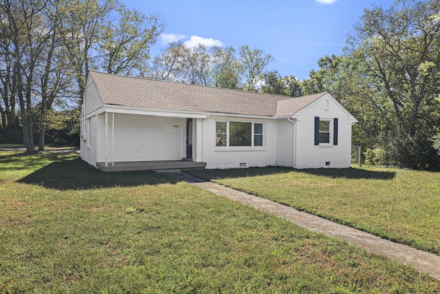 ranch-style house with a front lawn