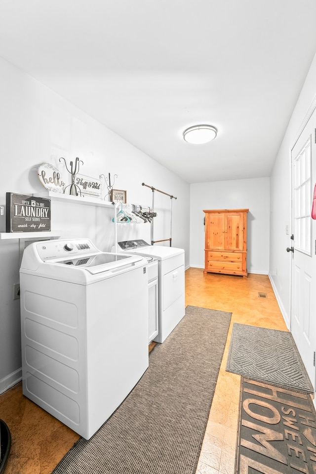 washroom with separate washer and dryer