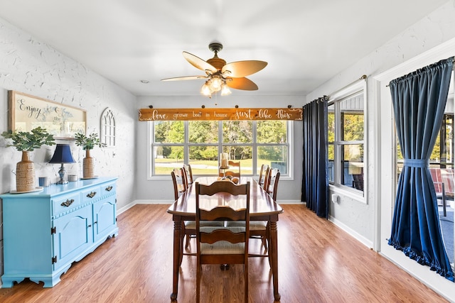 dining area with ceiling fan, light wood-type flooring, and plenty of natural light