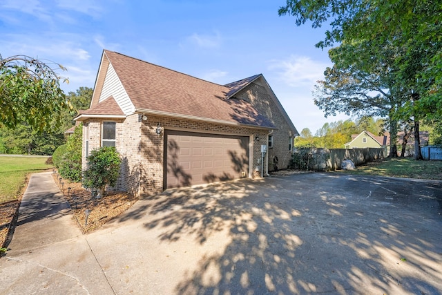 view of side of home with a garage