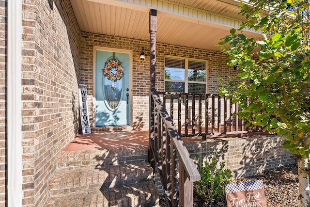 doorway to property featuring a porch