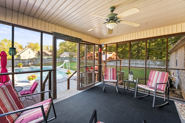 sunroom with wood ceiling and ceiling fan