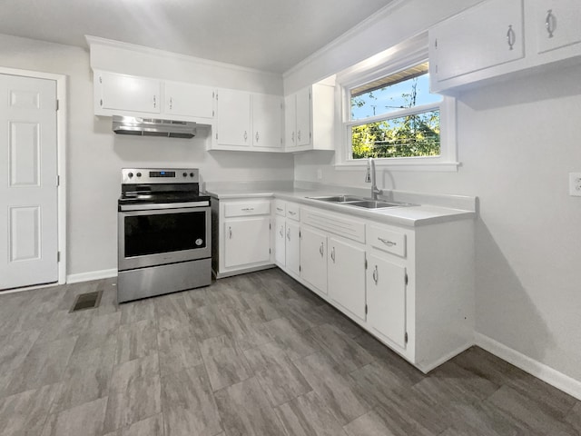 kitchen with exhaust hood, stainless steel electric stove, ornamental molding, sink, and white cabinets