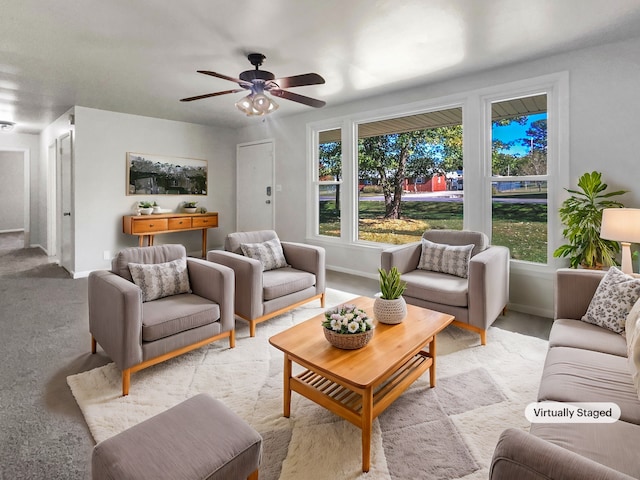 carpeted living room featuring ceiling fan and a healthy amount of sunlight