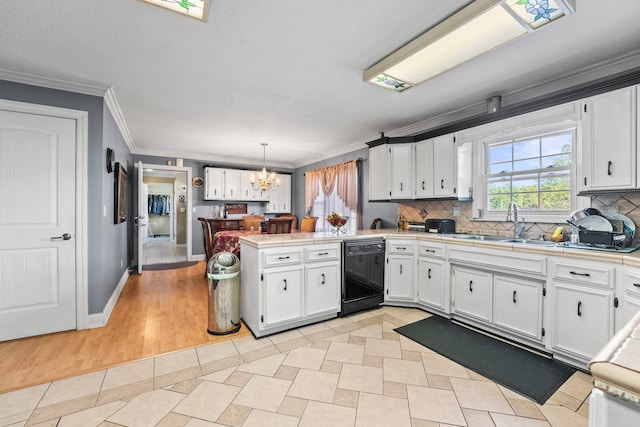 kitchen with kitchen peninsula, dishwasher, white cabinets, and hanging light fixtures