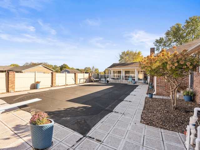 view of swimming pool featuring a patio area