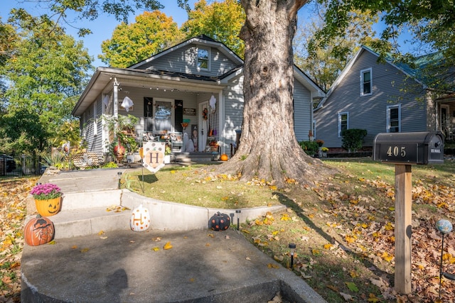 bungalow-style house featuring a front yard and a porch