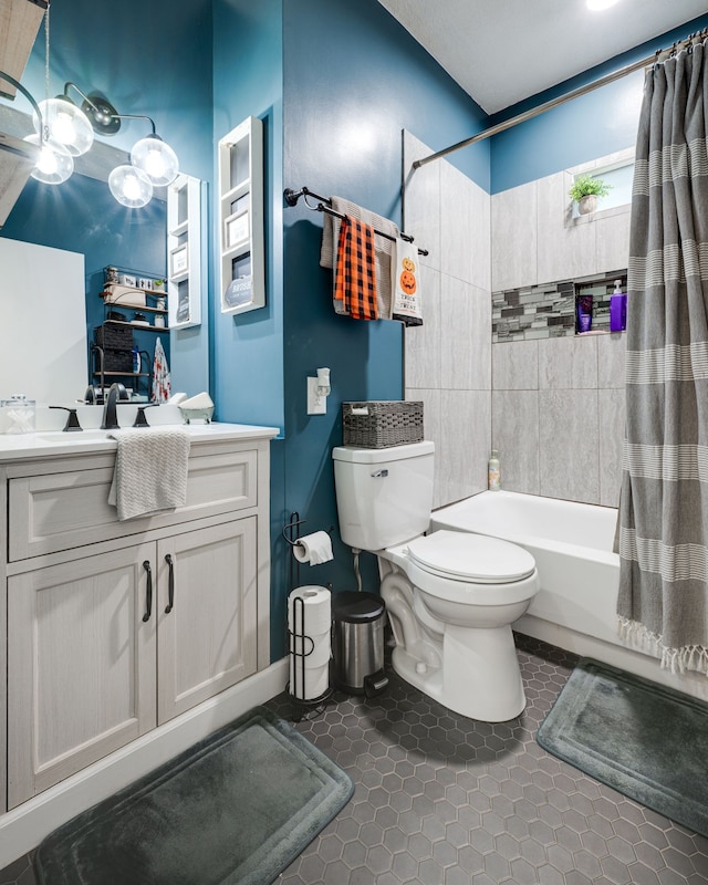 full bathroom with vanity, toilet, tile patterned floors, and shower / tub combo with curtain