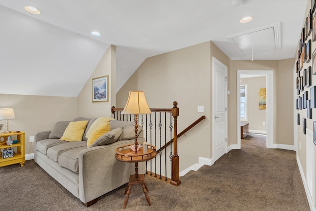 living room featuring vaulted ceiling and dark colored carpet