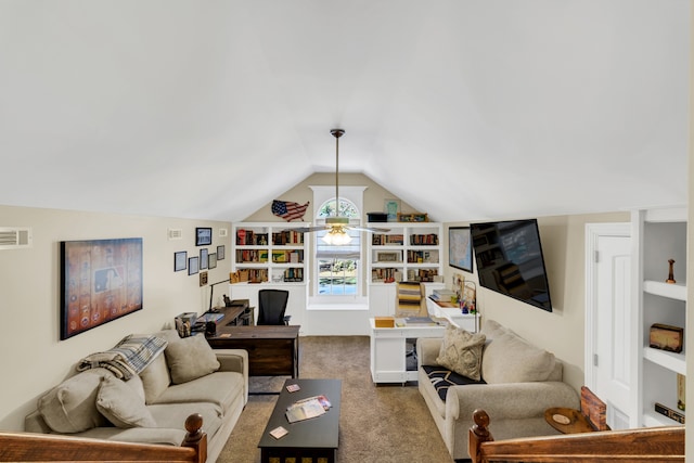 carpeted living room featuring vaulted ceiling, built in shelves, and ceiling fan