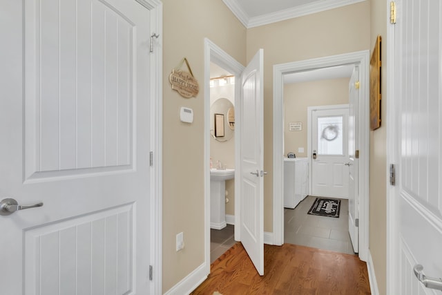 hallway with ornamental molding and wood-type flooring