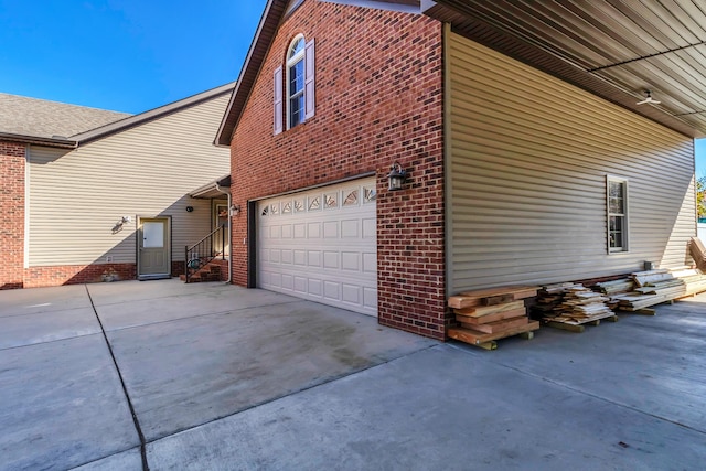 view of side of property with a garage