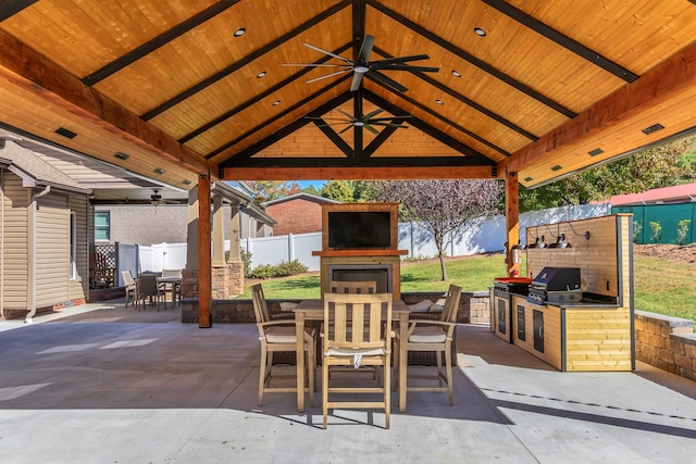 view of patio / terrace featuring a gazebo, area for grilling, a grill, and ceiling fan