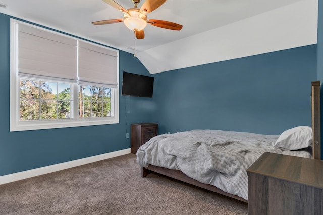 bedroom featuring carpet flooring, vaulted ceiling, and ceiling fan