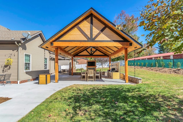 view of home's community featuring a yard, a gazebo, and a patio