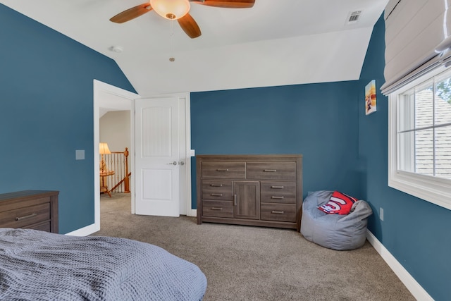 bedroom featuring ceiling fan, carpet, and vaulted ceiling