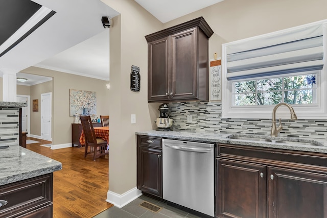 kitchen featuring sink, dishwasher, dark brown cabinetry, dark wood-type flooring, and decorative backsplash