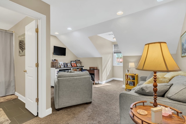 carpeted living room featuring vaulted ceiling