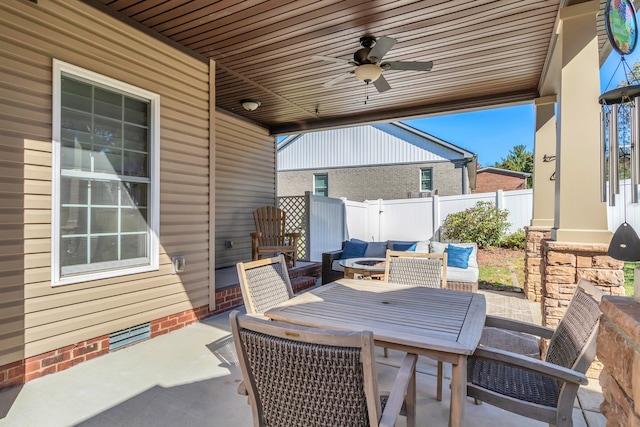 view of patio featuring ceiling fan