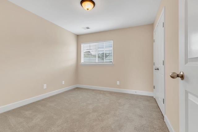 unfurnished room with light colored carpet