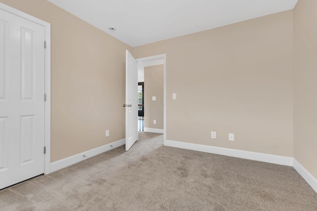 unfurnished bedroom with light carpet