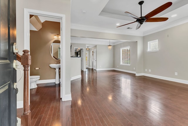 unfurnished living room with crown molding, ceiling fan, and dark hardwood / wood-style flooring