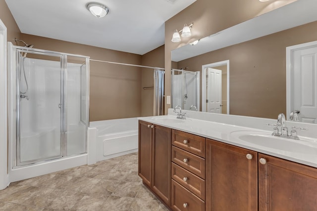 bathroom with vanity and separate shower and tub