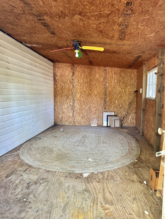 interior space with ceiling fan