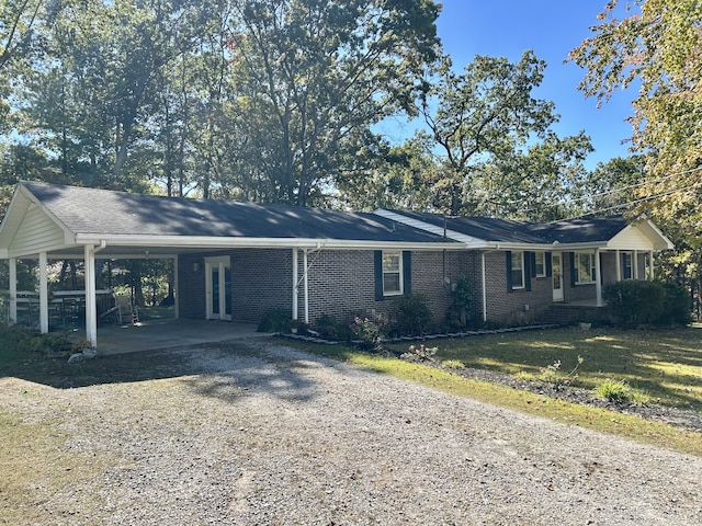 ranch-style house with a carport